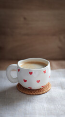 cup of coffee on a simple background, cozy home, notebook and coffee, coffee beans, flatlay,...