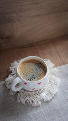 cup of coffee on a simple background, cozy home, notebook and coffee, coffee beans, flatlay,...