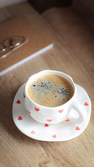 cup of coffee on a simple background, cozy home, notebook and coffee, coffee beans, flatlay, background