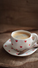 cup of coffee on a simple background, cozy home, notebook and coffee, coffee beans, flatlay,...