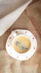 cup of coffee on a simple background, cozy home, notebook and coffee, coffee beans, flatlay,...