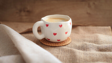 cup of coffee on a simple background, cozy home, notebook and coffee, coffee beans, flatlay, background