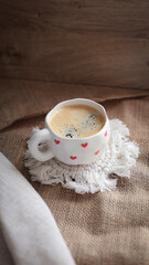 cup of coffee on a simple background, cozy home, notebook and coffee, coffee beans, flatlay, background