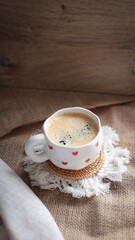 cup of coffee on a simple background, cozy home, notebook and coffee, coffee beans, flatlay, background