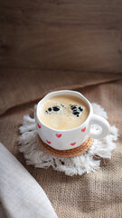 cup of coffee on a simple background, cozy home, notebook and coffee, coffee beans, flatlay, background