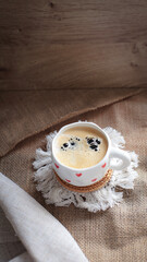 cup of coffee on a simple background, cozy home, notebook and coffee, coffee beans, flatlay, background