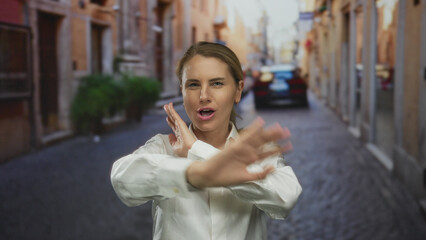 Fototapeta premium Woman smiling joyfully on city street with historic buildings in urban outdoor setting.