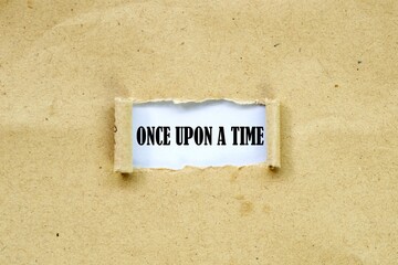 ONCE UPON A TIME in the middle of torn brown paper. white background.
