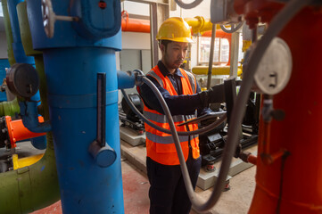 A maintenance engineer is checking the pressure of a gas pipeline in an industrial plant
