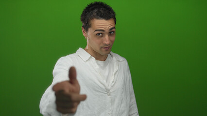 Man finger pointing directly to camera in studio; invitation connection engagement confidence.