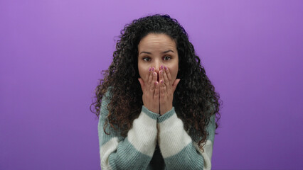 Woman expressing emotion in a video frame over a purple background, wearing a sweater, isolated,...