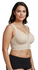 Obraz premium Woman wearing a medical back support brace over casual clothing, standing indoors. Perfect for health, recovery, posture correction, and orthopedic or physiotherapy-related visuals.