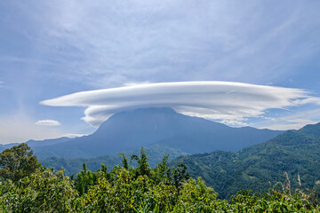 Stunning lenticular cloud formation over Mount Kinabalu, Sabah, Malaysia. A rare weather phenomenon captured above Borneoâ€™s highest peak.
