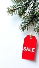 Red "SALE" Christmas tag with string, hanging from a snow-dusted pine branch against a clean white background. Perfect for holiday promotions and winter sales.