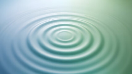Concentric water ripples in calm blue and green tones creating a peaceful abstract background