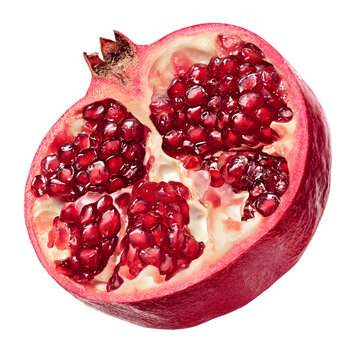 Close up of a ripe red pomegranate cut in half revealing juicy arils isolated on transparent background