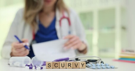Word Scurvy formed from alphabet cubes put near scattered vitamin capsules. Female medical expert reads paper analyzing missing elements in nutrition