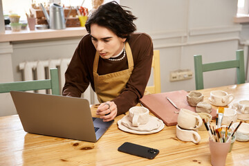 Stylish man immersed in pottery creation while exploring artistic ideas in a vibrant studio