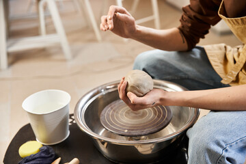 Creative expression of a handsome man shaping clay in a pottery studio filled with inspiration