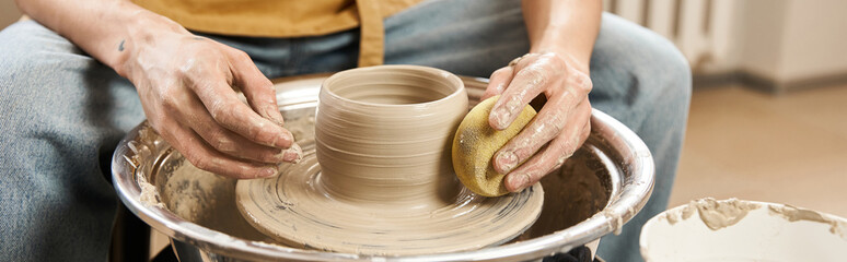 Creative hands shaping clay in a pottery studio filled with inspiration and artistic energy