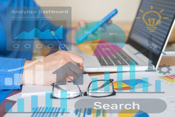 Business analyst evaluating company performance through an analytics dashboard, analyzing charts and graphs to track progress and make data-driven decisions for growth