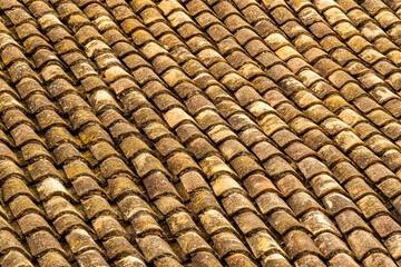 orange and brown old tile roof texture background. Old vintage roof tiles backdrop for concept and design.