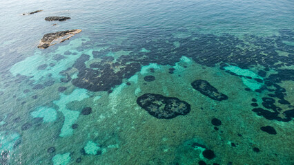 Rocky Outcrops and Coral Reef Shadows – Aerial View of Mediterranean Waters in Calabria, Italy