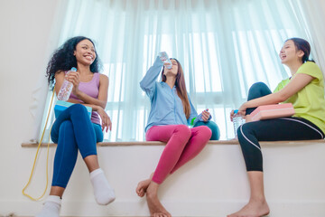 Diverse Group of Female Friends Resting After Workout