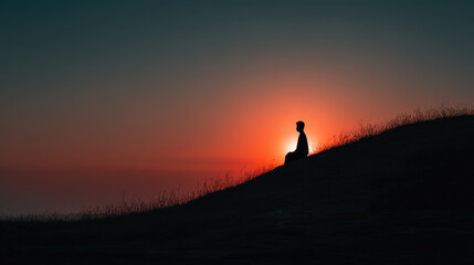Meditating person enjoying the sunset on a hill, a moment of peace and reflection.