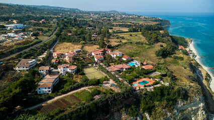 Resort Villas, Pools, and Tennis Court – Aerial View of Coastal Complex in Calabria, Italy