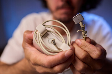 Carefully Repairing a Damaged Charging Cable with Skillful Hands for Best Results and Safety