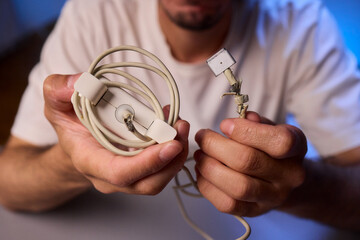 Carefully Repairing a Damaged Charging Cable with Skillful Hands for Best Results and Safety