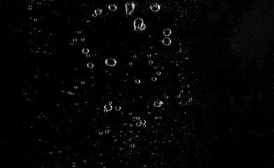 Underwater bubbles, Underwater oxygen design concept, Small water drops underwater, On black background, Close-up photography.