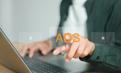 Ads text on laptop display screen from advertisers on internet. Ads banner campaign to target.digital marketing concept.online rich media native targeting advertising marketing strategy.