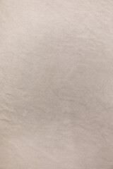 Obraz premium Soft beige textured surface with subtle variations in color and pattern captured during daylight