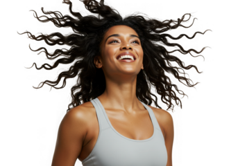 Smiling woman with curly hair looking up against dark space on transparent background