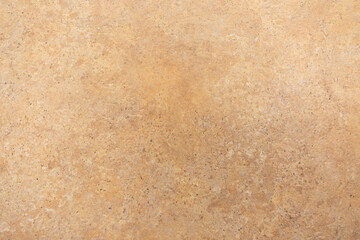 Beautiful textured surface showcasing a warm beige color with natural patterns and subtle variations in tones