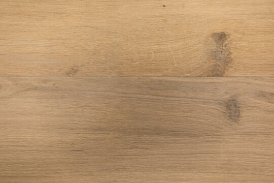 Natural wood flooring with light grains and a smooth finish in a modern interior setting