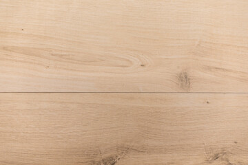 Natural wood grain flooring with a light finish showcasing unique patterns and textures