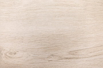 Wooden table surface showcasing light grain texture ideal for decorative purposes or crafting activities