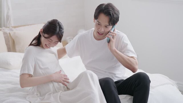妻に陣痛がきて産婦人科に電話する夫