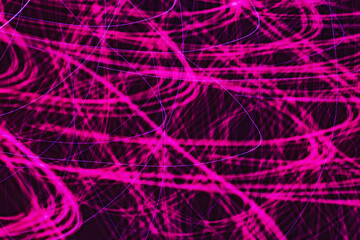 Vibrant pink streaks dance across a dark background creating energetic patterns