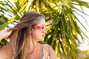 Beautiful Woman with Long Gray Hair and Modern Glasses. Natural Beauty and Timeless Style