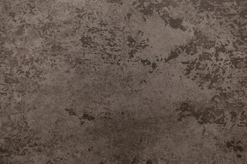 Textured surface with an abstract brown pattern showcasing unique design elements and subtle variations in tone