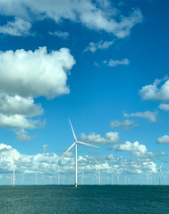 Offshore wind turbines in the sea, showing clean energy infrastructure, sustainability, and green...