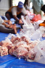 workers process goat meat for eid al-adha