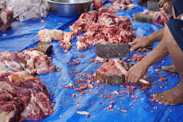 workers process goat meat for eid al-adha