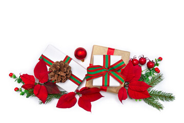 Christmas decoration. Christmas flat lay with fir branches, poinsettia flowers, gift boxes and...