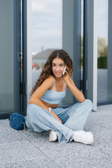 Girl Talking On Smartphone Outdoors