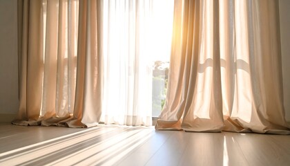 Sunlight streams through beige curtains onto a light-wood floor
